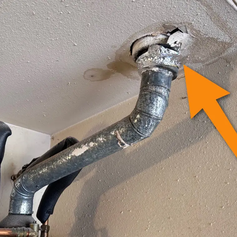 Gas water heater vent pipe checked during an inspection